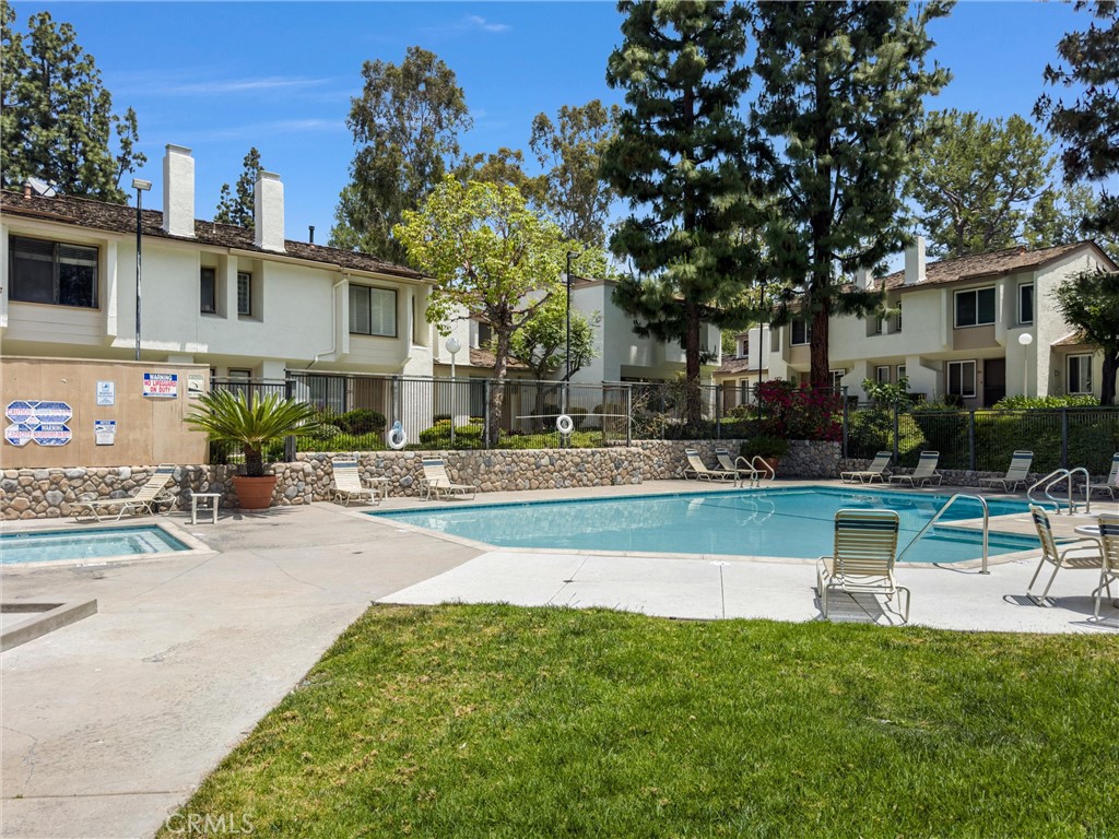 255 Scenic Way Brea, CA 92821 - Photo 50 of 57 a view of a patio with couches and a table and chairs with wooden fence
