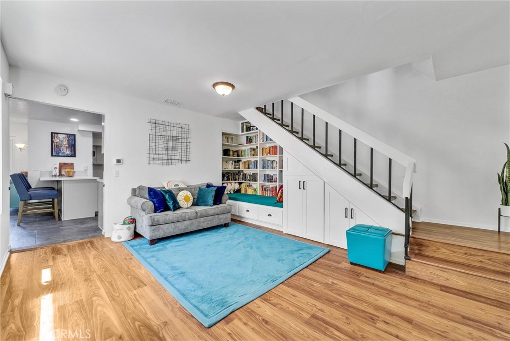 255 Scenic Way Brea, CA 92821 - Photo 7 of 57 a living room with wooden floor and a rug
