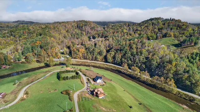 a view of a swimming pool with a yard