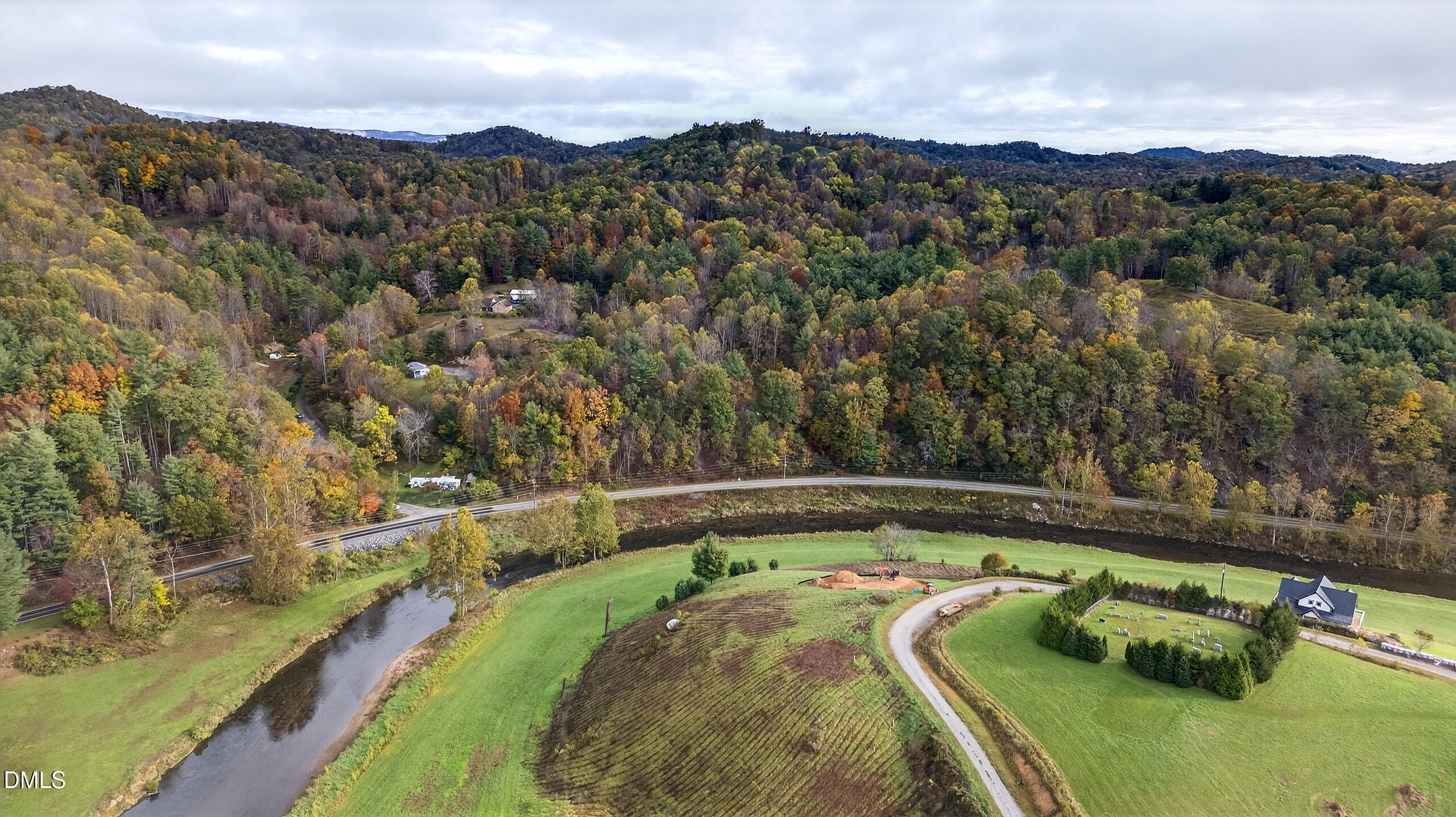 262 River Landing Way Warrensville, NC 28693 - Photo 19 of 25 a view of a lake with a mountain in the background