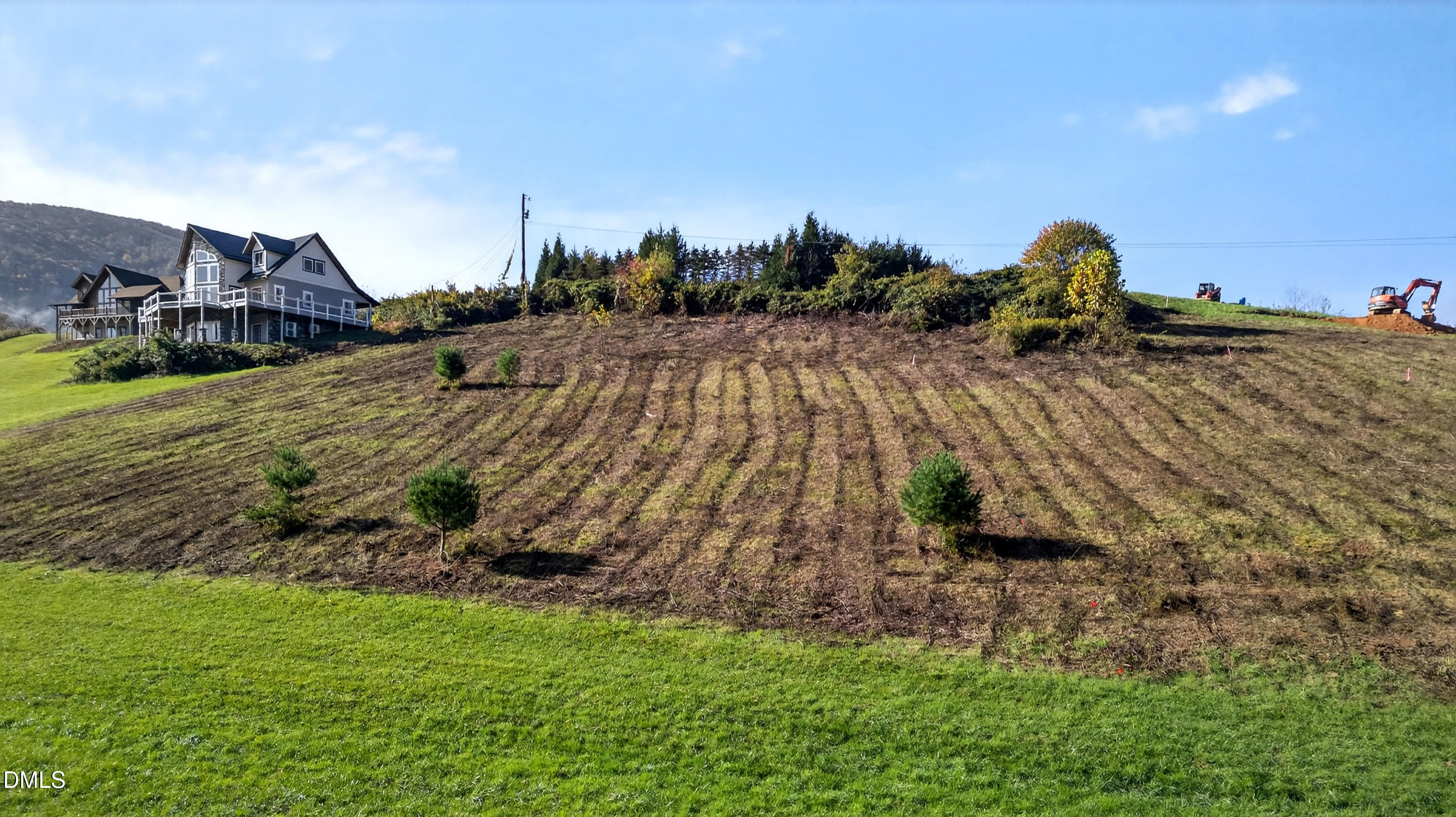 262 River Landing Way Warrensville, NC 28693 - Photo 23 of 25 a view of a house with a yard