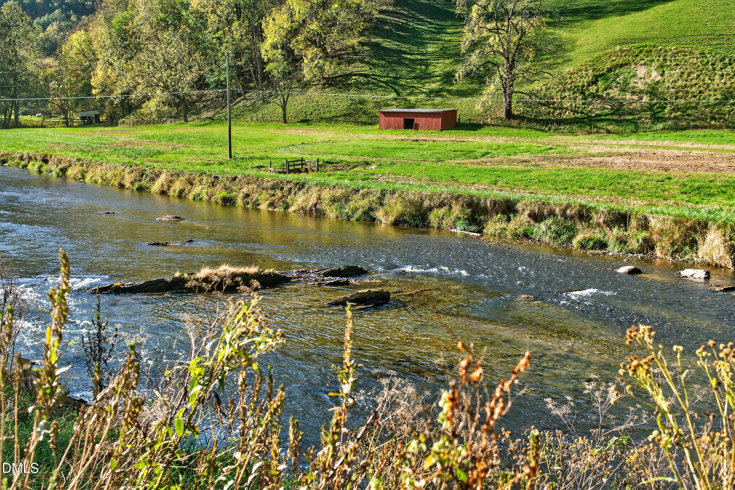 262 River Landing Way Warrensville, NC 28693 - Photo 4 of 25 a view of a lake with a big yard