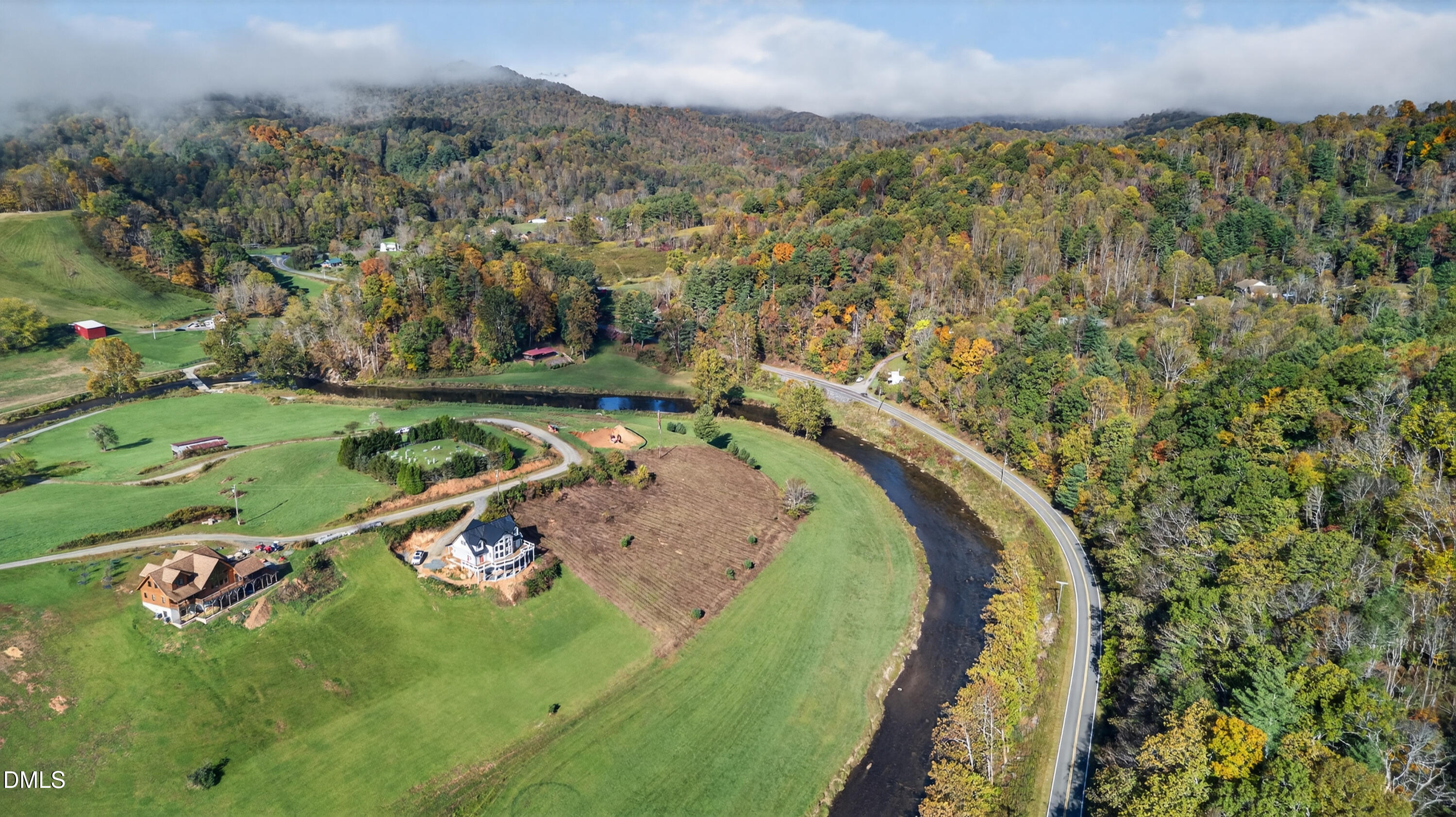 262 River Landing Way Warrensville, NC 28693 - Photo 10 of 25 an aerial view of a house with a yard and lake view