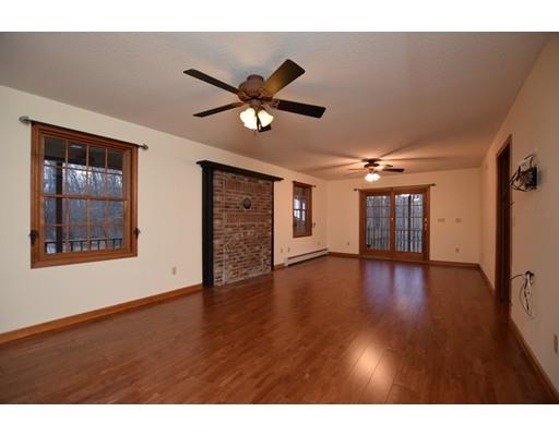 190 Old Gilbertville Road Ware, MA 01082 - Photo 9 of 30 a view of empty room with wooden floor and fan