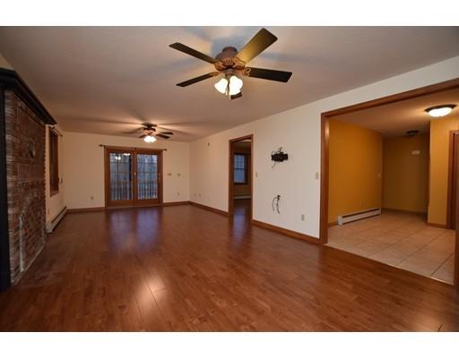 190 Old Gilbertville Road Ware, MA 01082 - Photo 10 of 30 a view of a livingroom with a ceiling fan and wooden floor