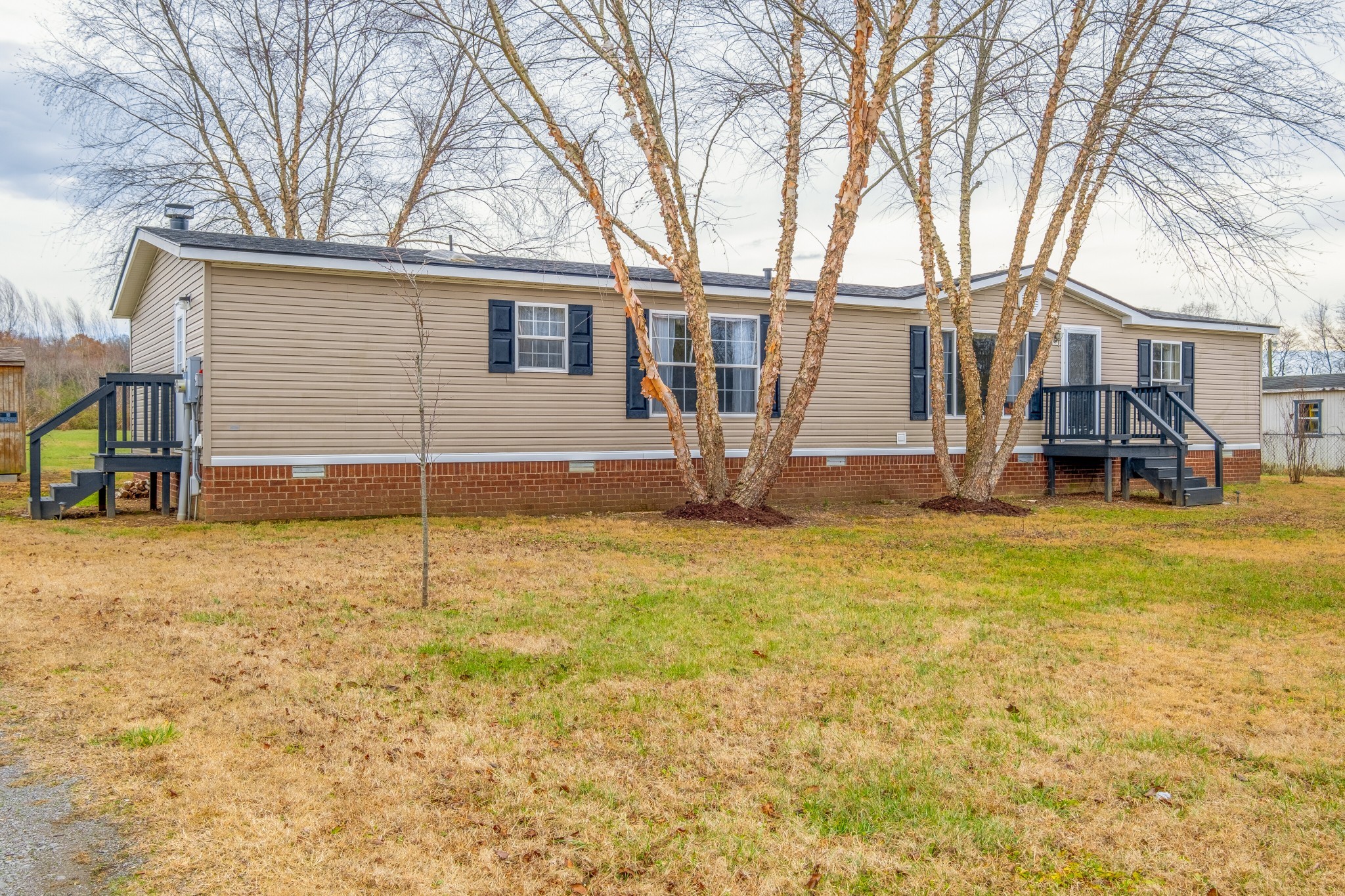 131 Blue Well Road Lebanon, TN 37090 - Photo 3 of 32 a view of a house with backyard and tree