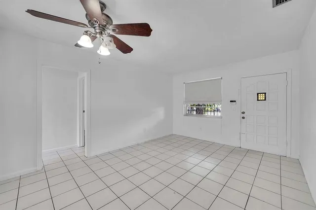 a view of an empty room and window