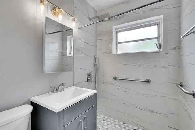 an empty room that has a window in it