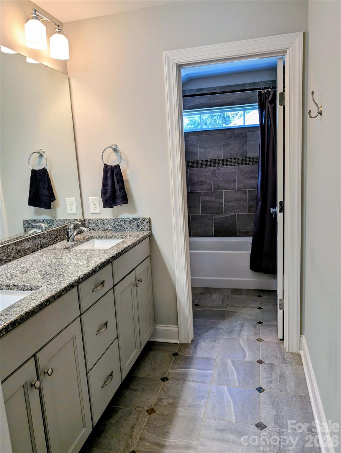 19934 Walter Henderson Road Cornelius, NC 28031 - Photo 22 of 35 a bathroom with a granite countertop sink and a mirror