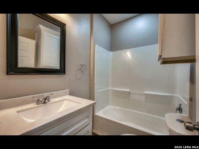 10901 Annaville Road Corpus Christi, TX 78410 - Photo 8 of 11 a bathroom with a sink and a bathtub