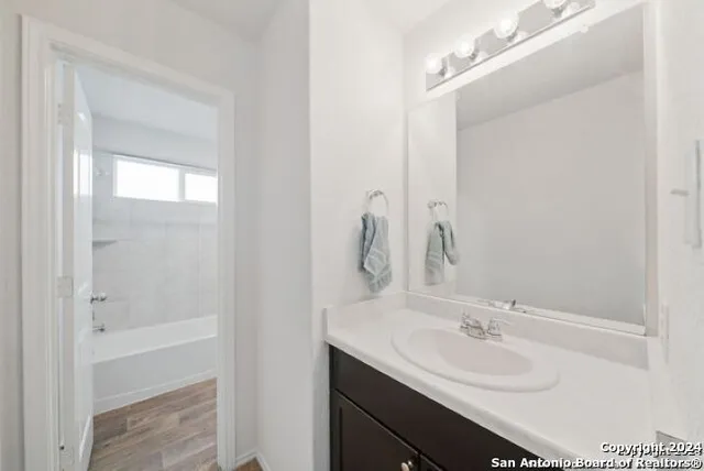 a bathroom with a double vanity sink mirror and double