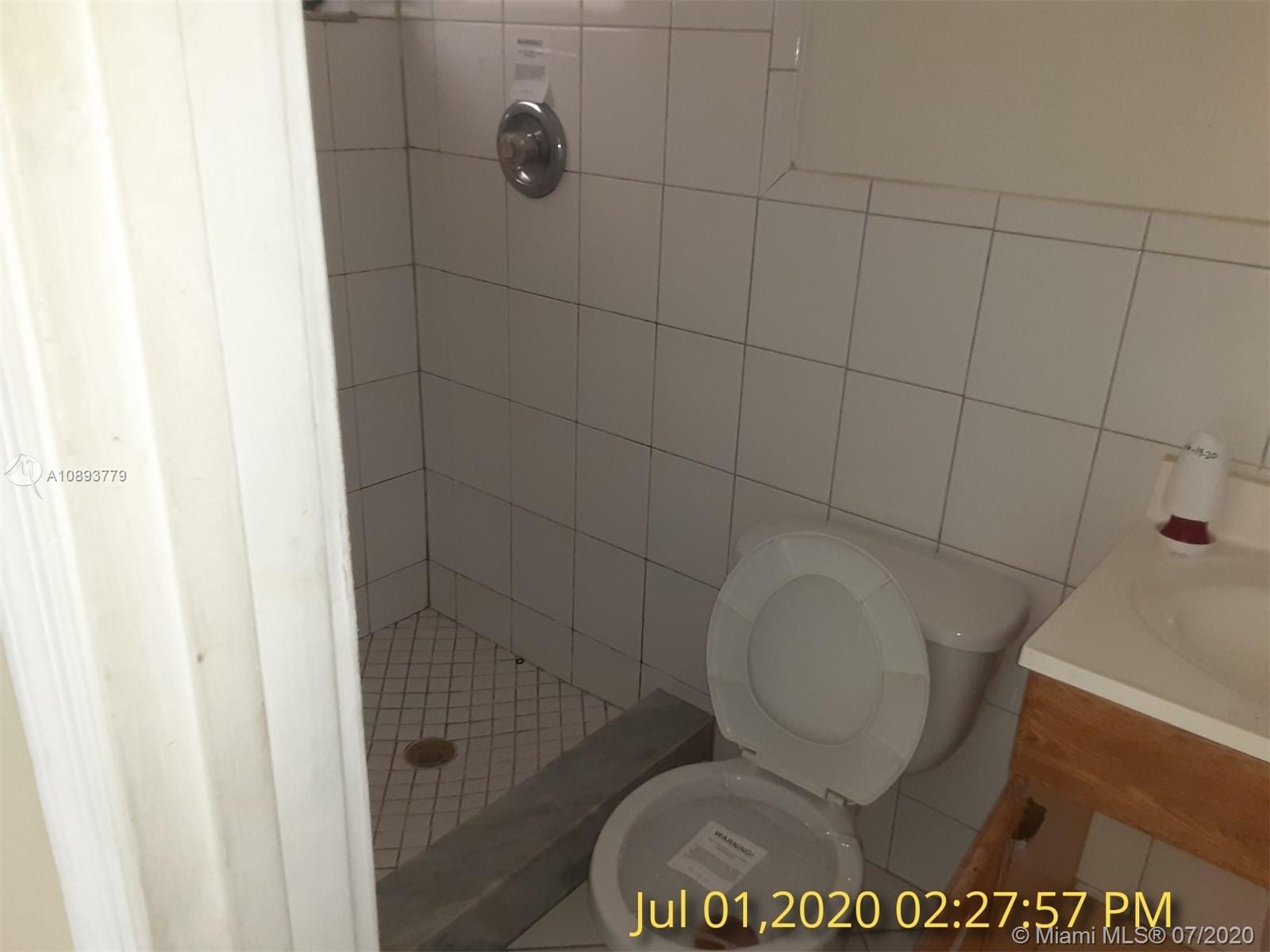 3530 Southwest 104th Avenue Miami, FL 33165 - Photo 13 of 29 a bathroom with a toilet and a shower