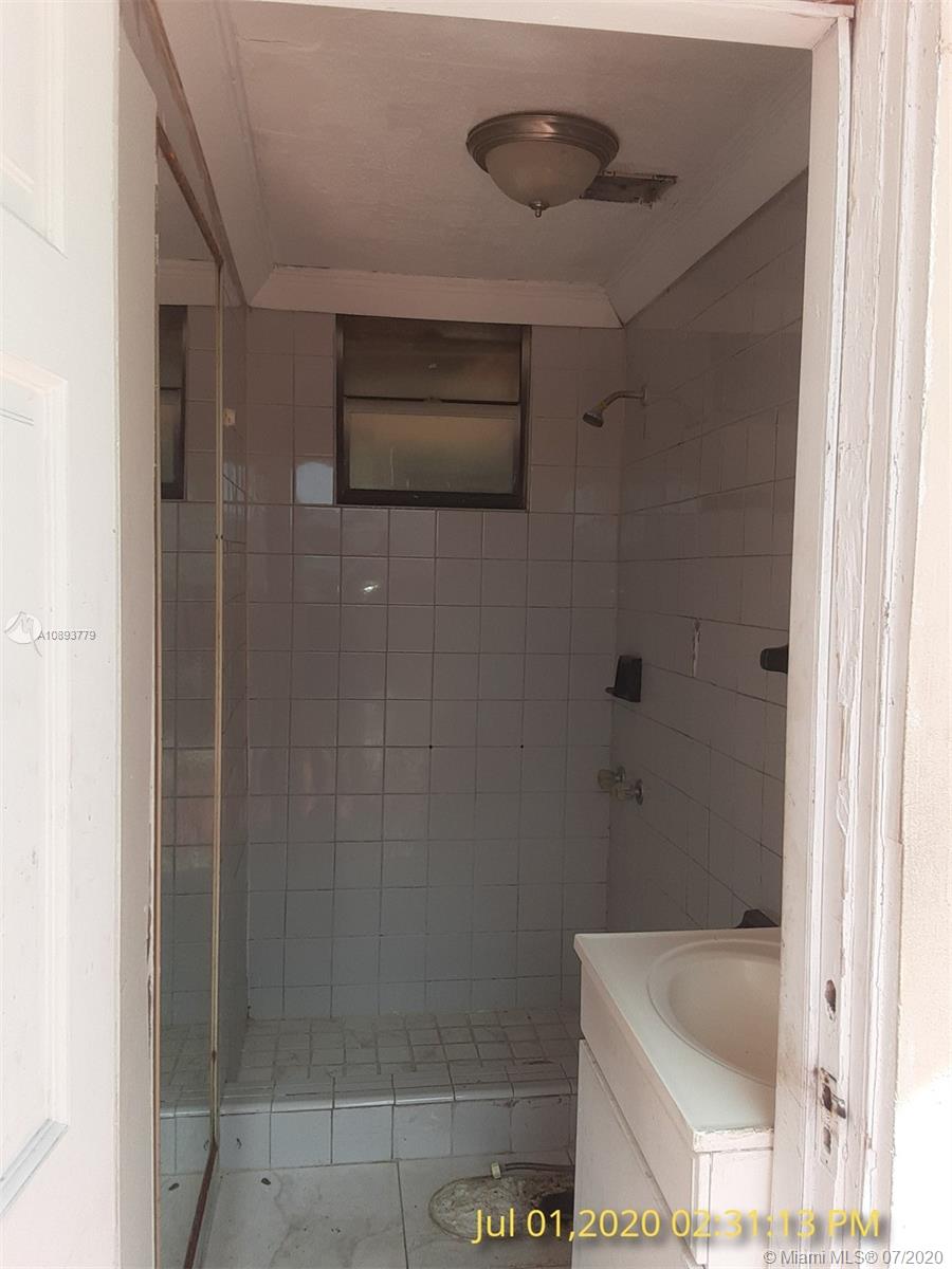3530 Southwest 104th Avenue Miami, FL 33165 - Photo 24 of 29 a bathroom with a shower and a sink
