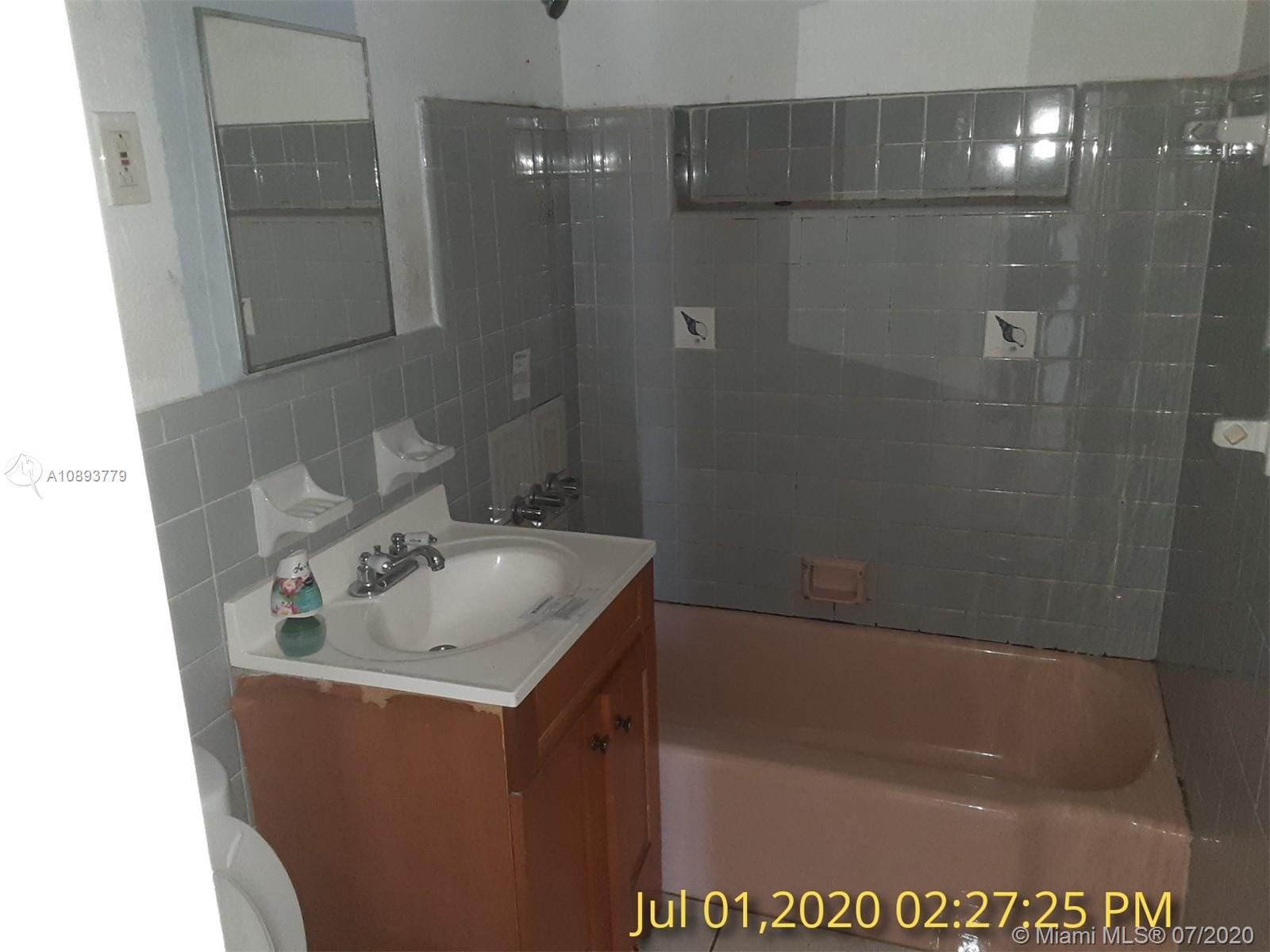 3530 Southwest 104th Avenue Miami, FL 33165 - Photo 8 of 29 a bathroom with a sink a mirror and a bathtub
