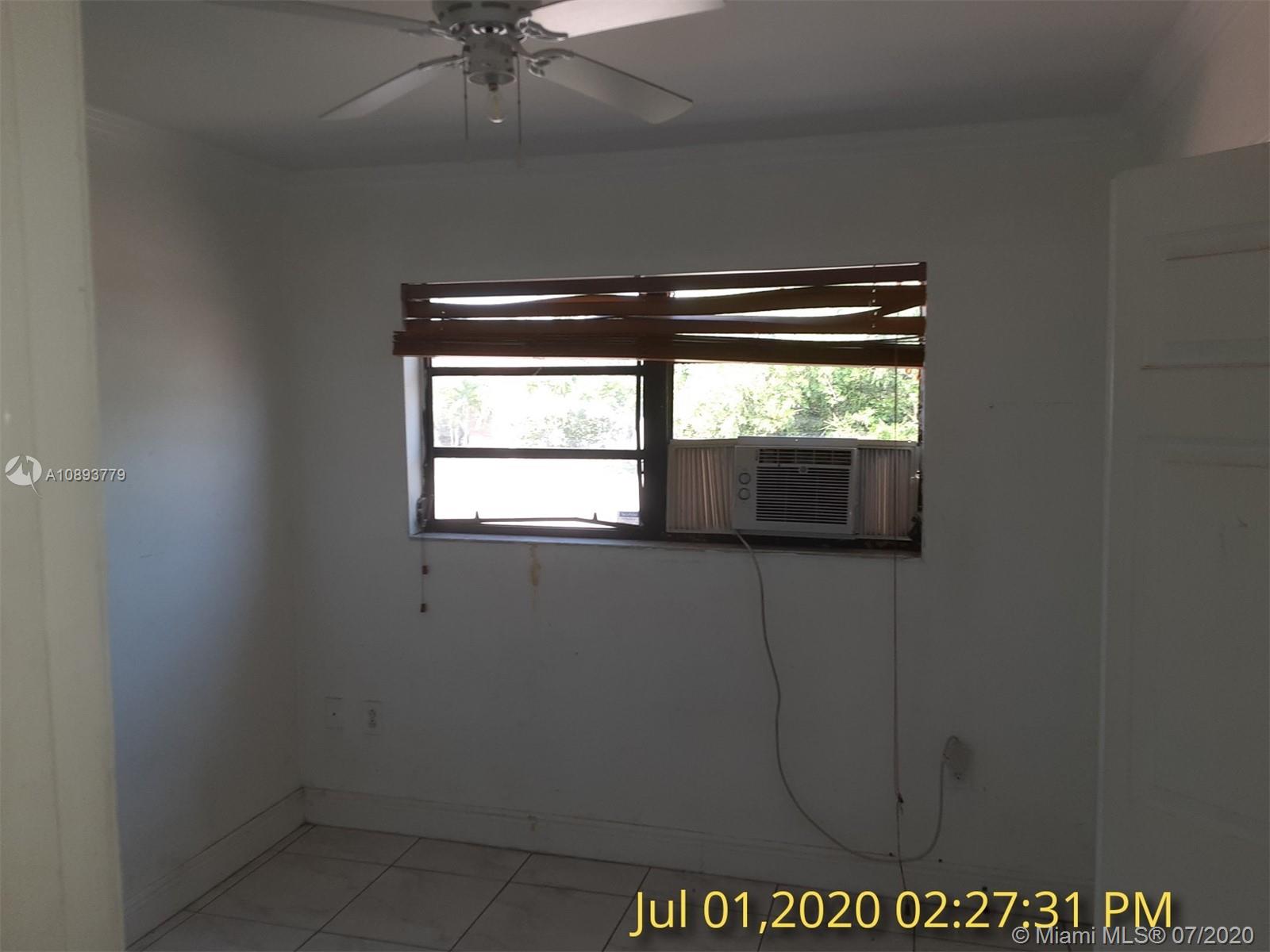 3530 Southwest 104th Avenue Miami, FL 33165 - Photo 9 of 29 a view of an empty room with a window