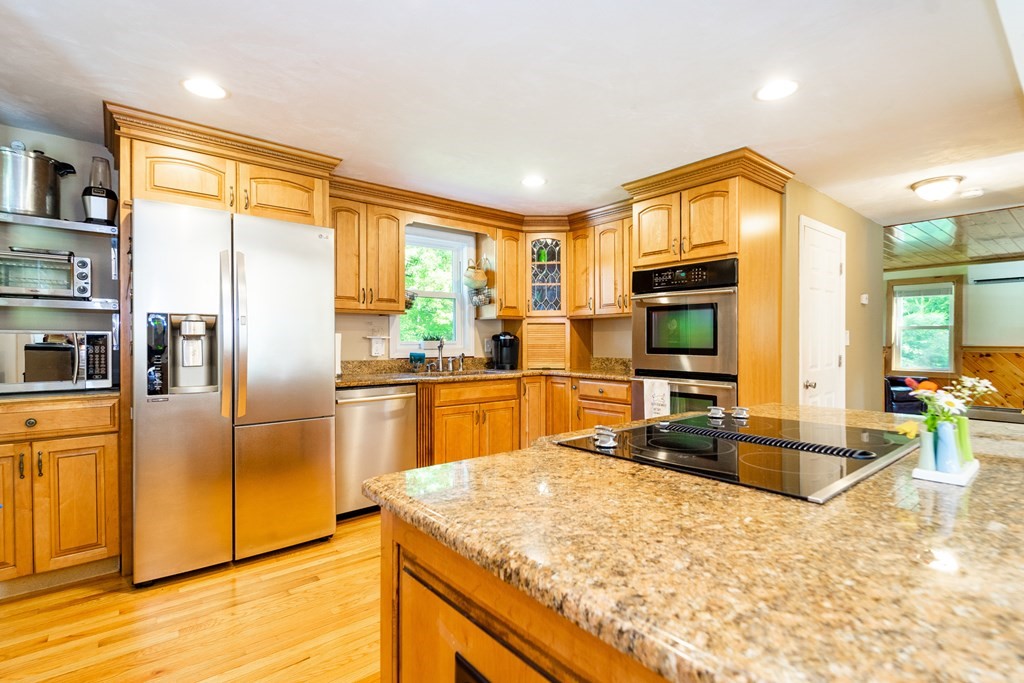 7 Braley Road Freetown, MA 02717 - Photo 10 of 42 a kitchen with stainless steel appliances granite countertop a sink refrigerator and cabinets
