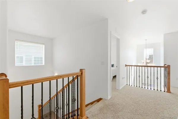 a view of a hallway with windows