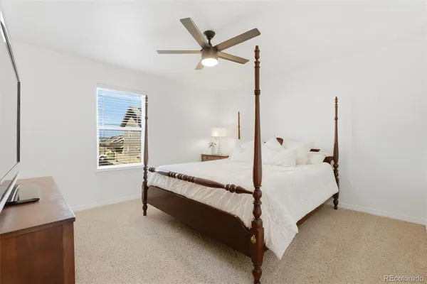 a bed room with a bed and a window