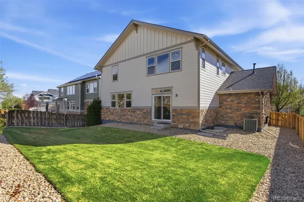 a view of a house with a yard and pathway