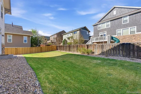 a view of a house with a yard and porch