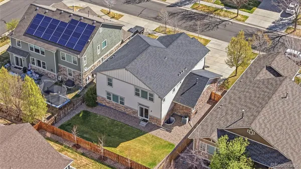 an aerial view of a house with a ocean view