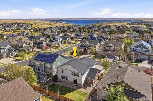 an aerial view of a house with a ocean view