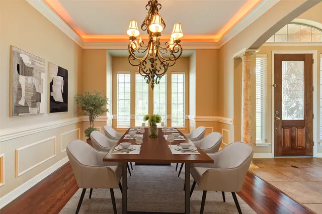 a view of a kitchen with stainless steel appliances granite countertop a refrigerator and a stove