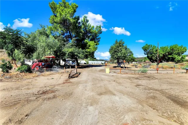 a view of street with parked cars