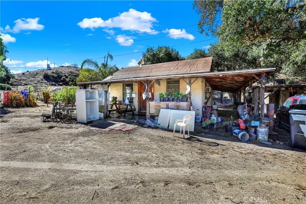 a room with wooden floor and furniture