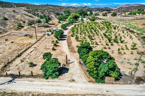 a street sign on a sidewalk next to a road