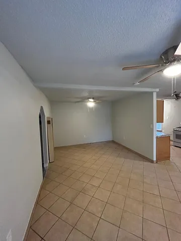 a view of an empty room and a window