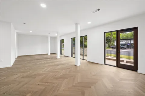 a view of an empty room with a sliding door