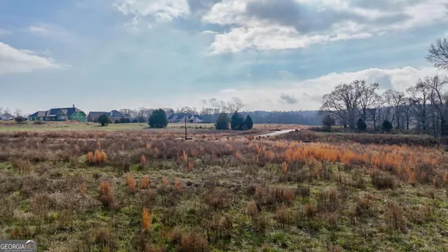 a view of a swimming pool with an outdoor seating area