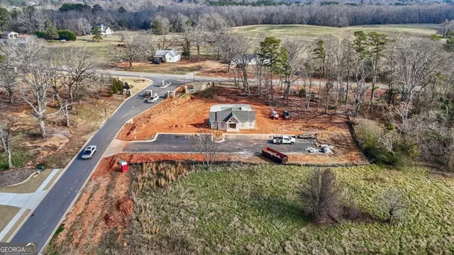 aerial view of a house with a yard