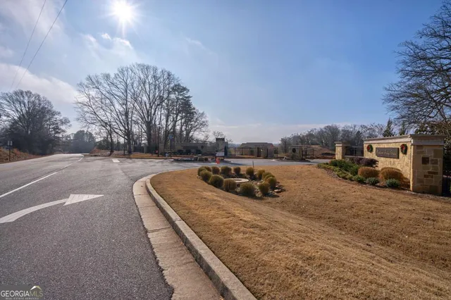a view of a cars park on the side of road