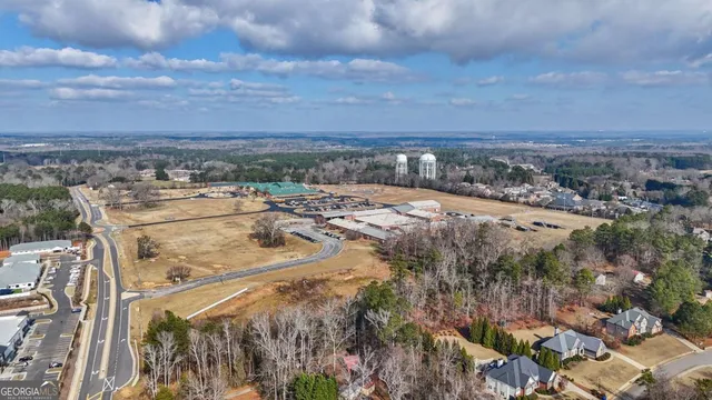 a view of a backyard with wooden fence