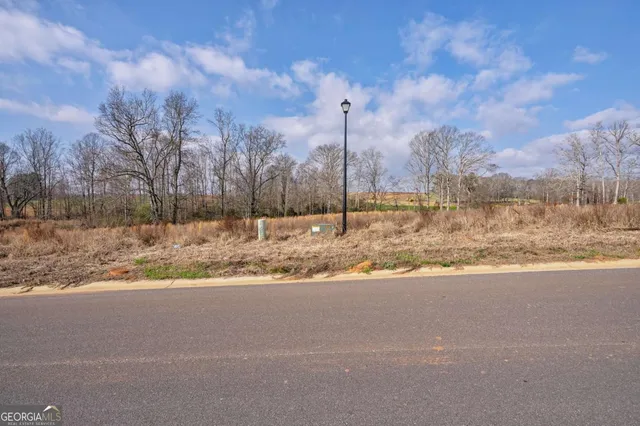 a view of a house with a snow on the side of the road