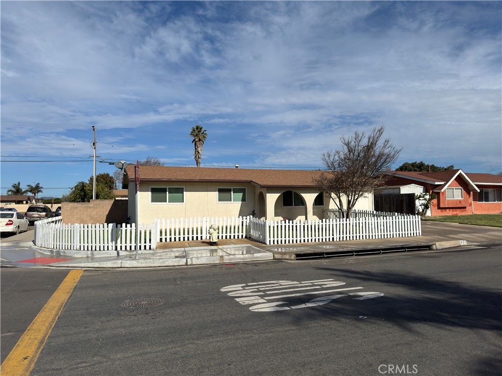 971 West Harding Avenue Santa Maria, CA 93458 - Photo 1 of 1 a front view of a house with a fence