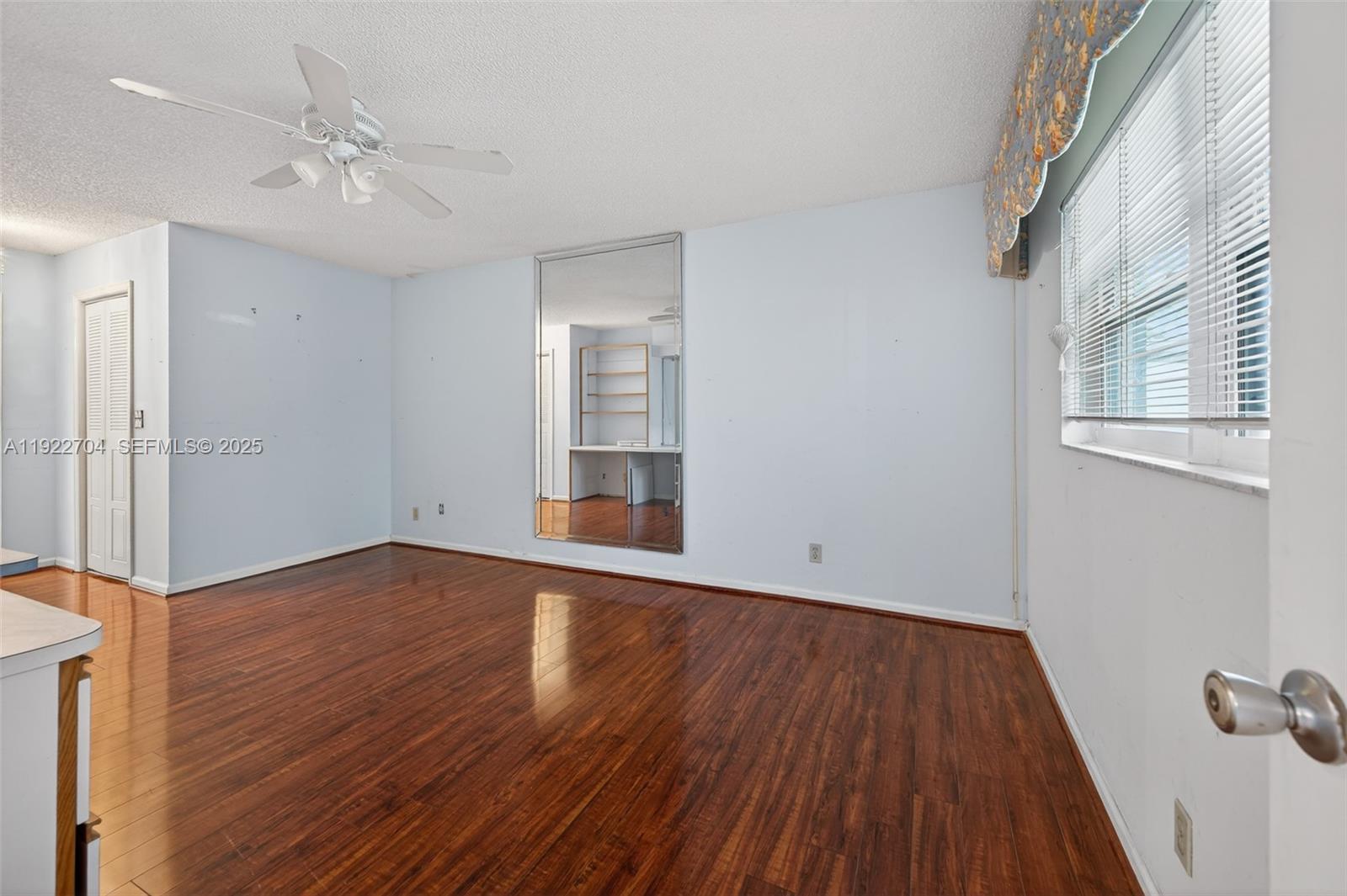 969 Northwest 8th Street Boca Raton, FL 33486 - Photo 16 of 38 wooden floor in an empty room with a window