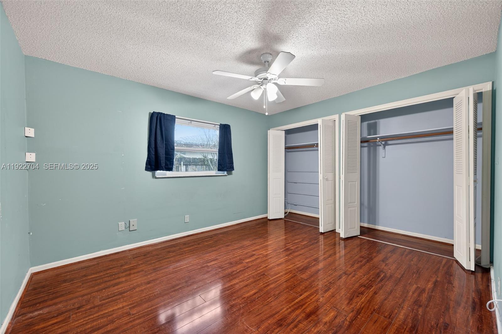 969 Northwest 8th Street Boca Raton, FL 33486 - Photo 21 of 38 wooden floor in an empty room with a window