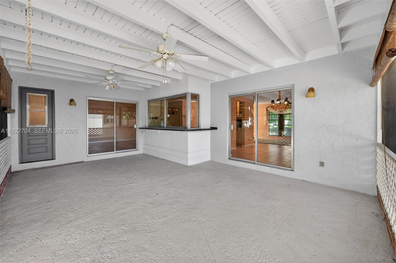 969 Northwest 8th Street Boca Raton, FL 33486 - Photo 26 of 38 wooden floor in an empty room with a window
