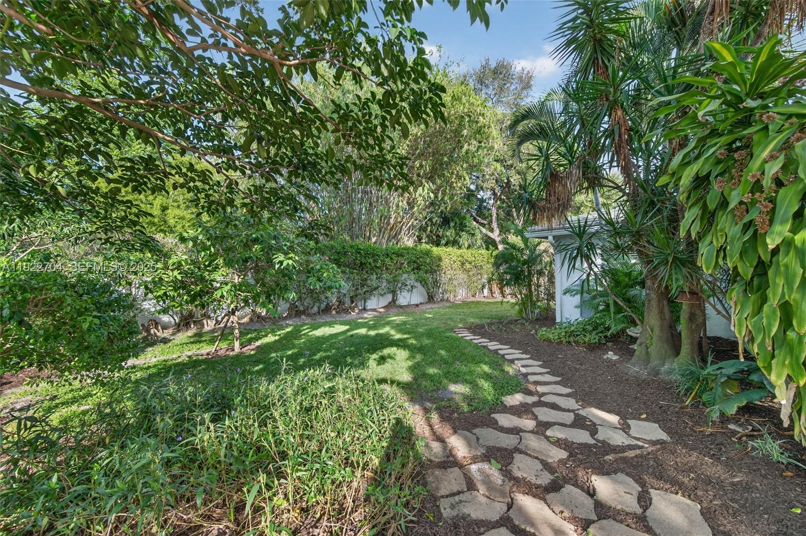 969 Northwest 8th Street Boca Raton, FL 33486 - Photo 31 of 38 a pathway of a yard