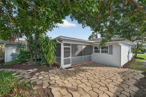 a house with trees in the background