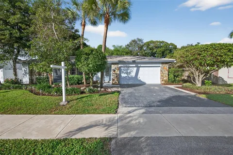 a view front of house with yard and green space