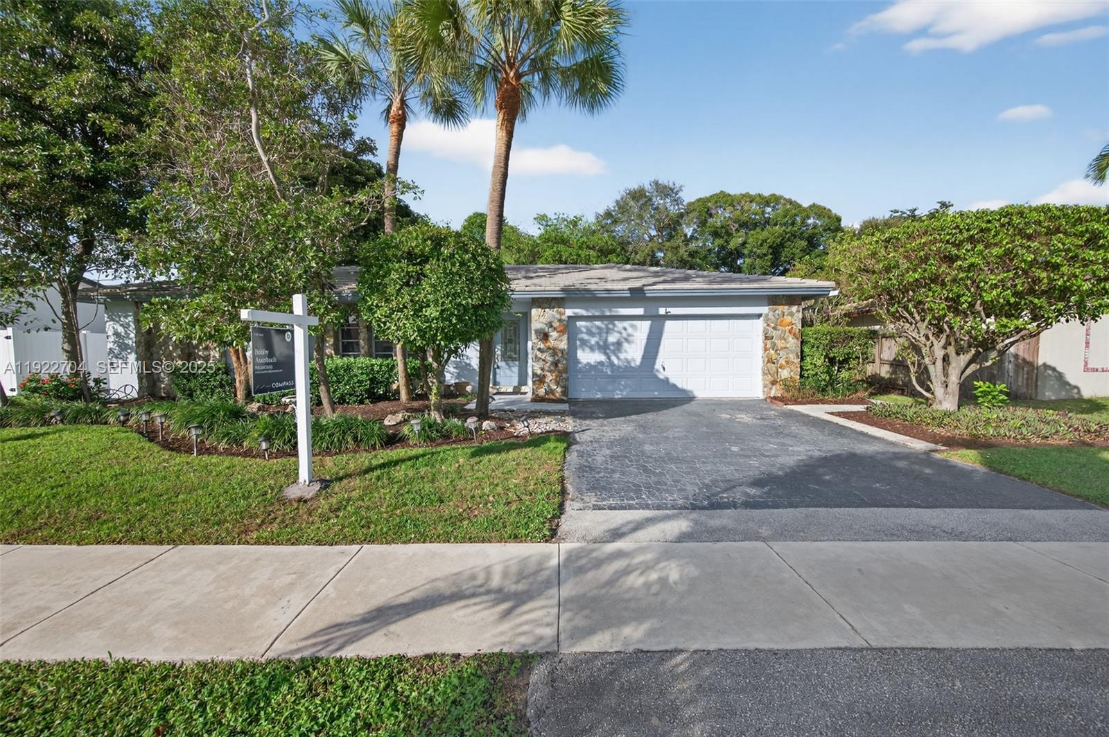 969 Northwest 8th Street Boca Raton, FL 33486 - Photo 36 of 38 a view front of house with yard and green space