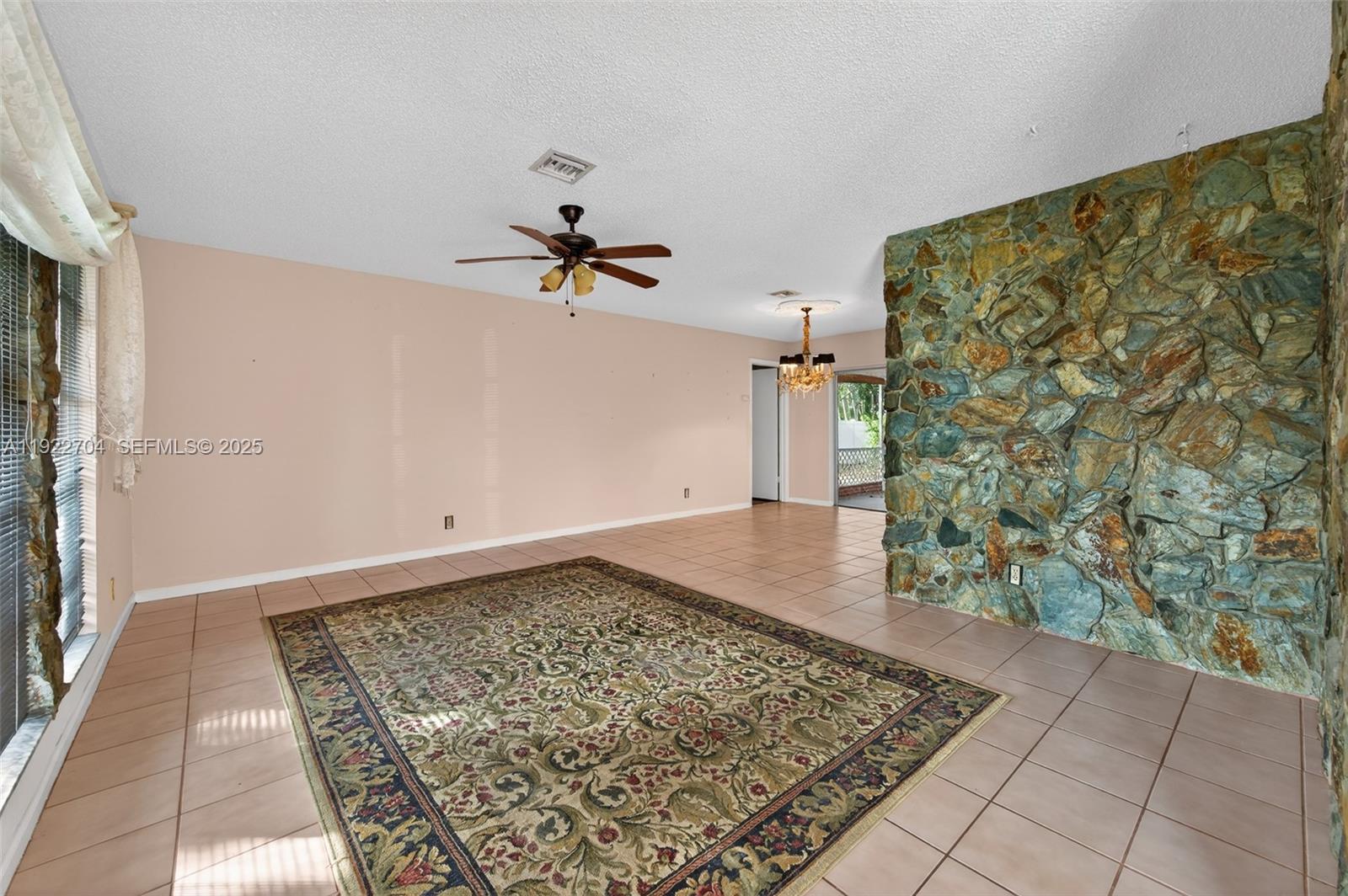 969 Northwest 8th Street Boca Raton, FL 33486 - Photo 4 of 38 a view of a room with a white walls and a rug