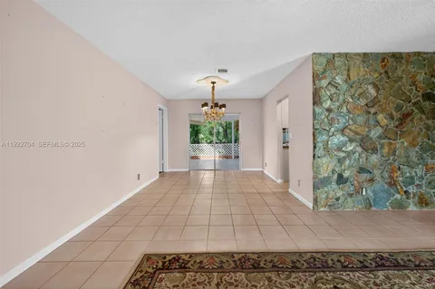 a view of a hallway with a window