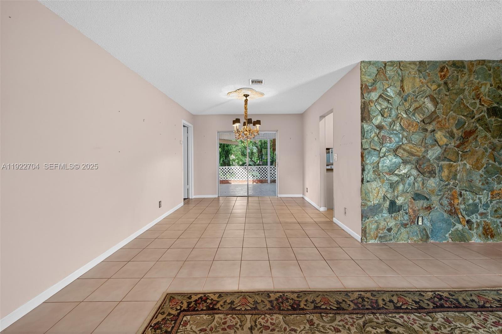 969 Northwest 8th Street Boca Raton, FL 33486 - Photo 5 of 38 a view of a hallway with a window