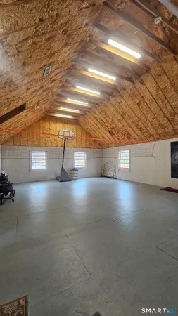 a bathroom with a toilet a sink and a mirror