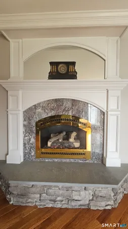 a living room with furniture fireplace and flat screen tv